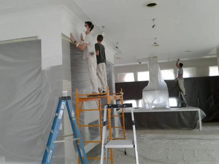 Atkisson Painting workers painting the walls in a residence